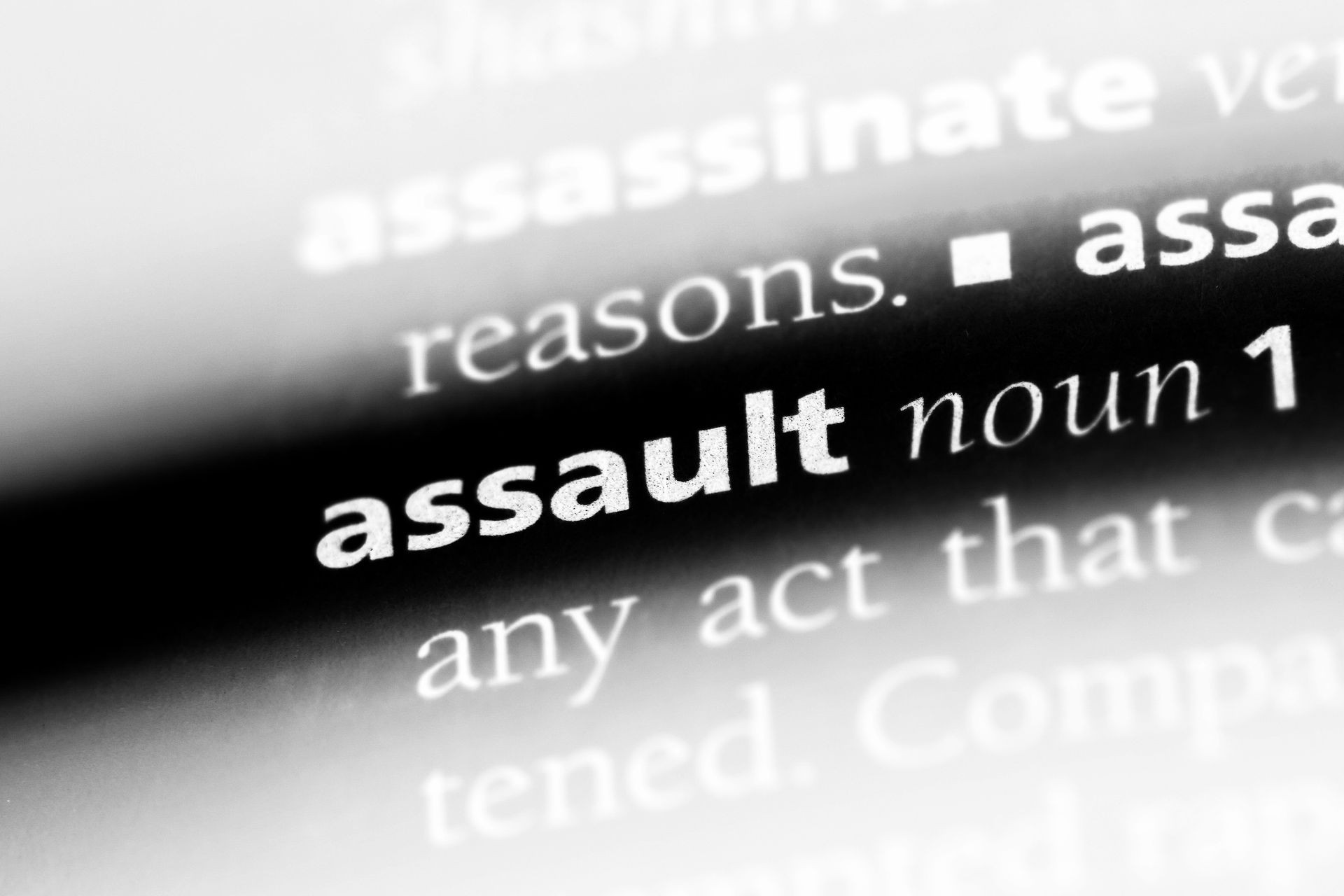 assault word in a dictionary. assault concept.