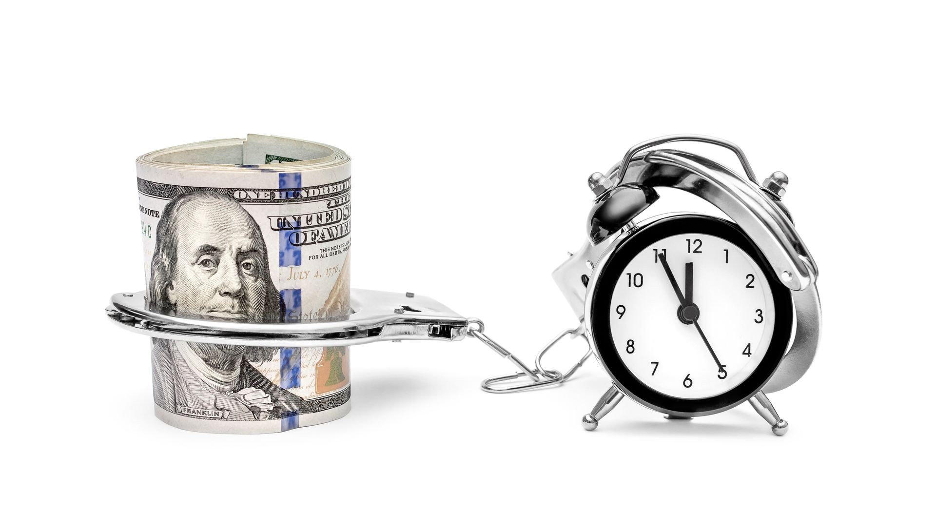 Clock connected by handcuffs with money on white. Clock connected by handcuffs with money on white.